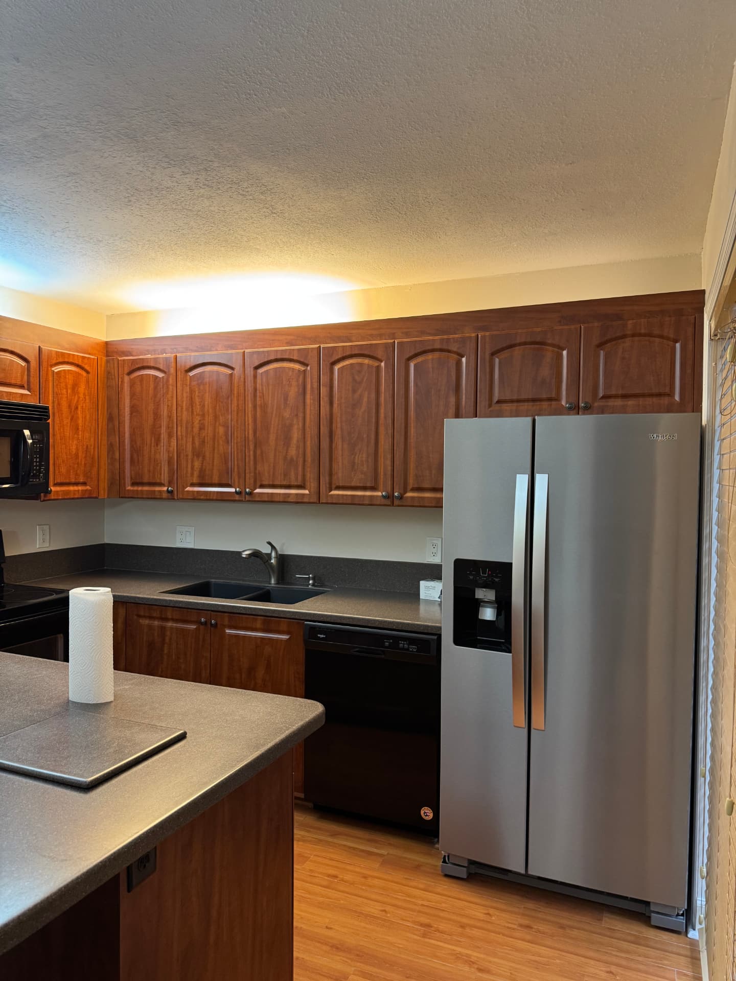 Move-in ready kitchen with clean countertops and polished cabinets after post-construction cleanup